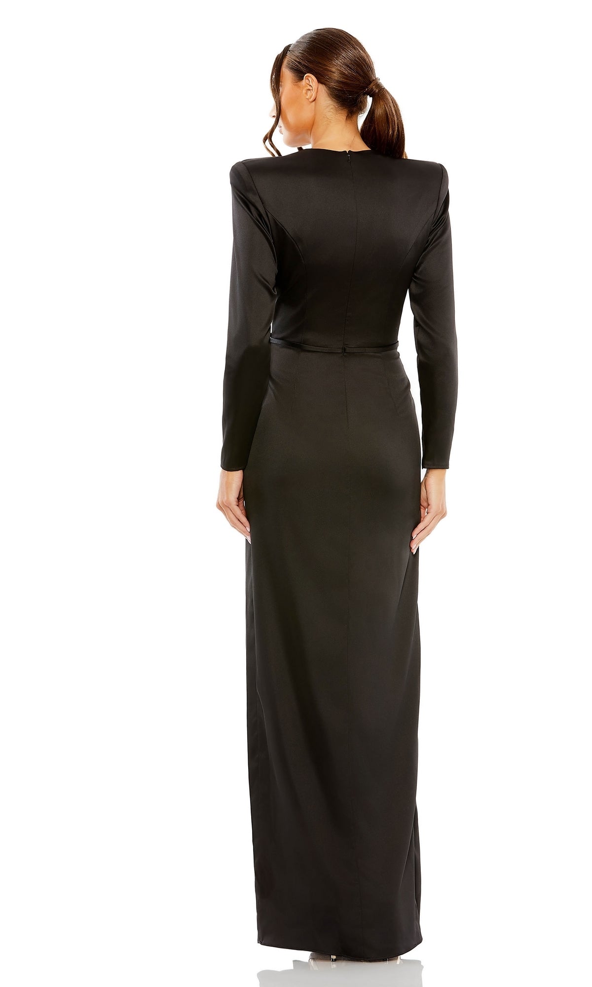 A woman with her hair in a low ponytail is seen from the back, wearing the floor-length black Mac Duggal 26676 Bold-Shoulder Long Formal Dress, featuring bra-friendly long sleeves.